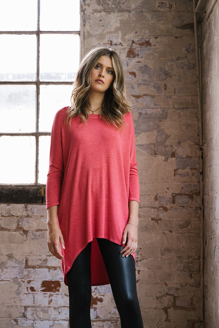 Flirty Long Line Dipped Back Knit
Top