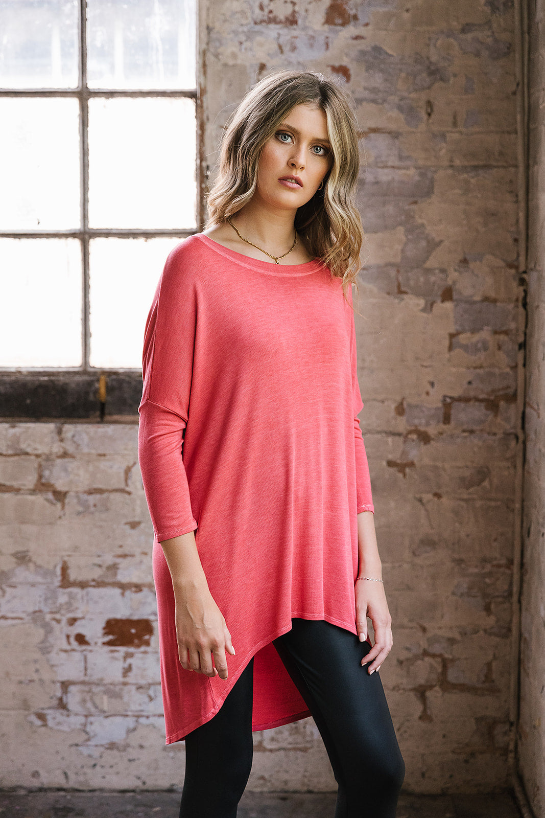 Flirty Long Line Dipped Back Knit
Top