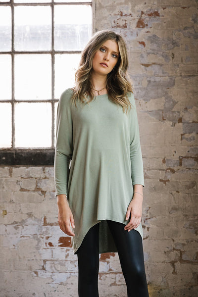 Flirty Long Line Dipped Back Knit
Top