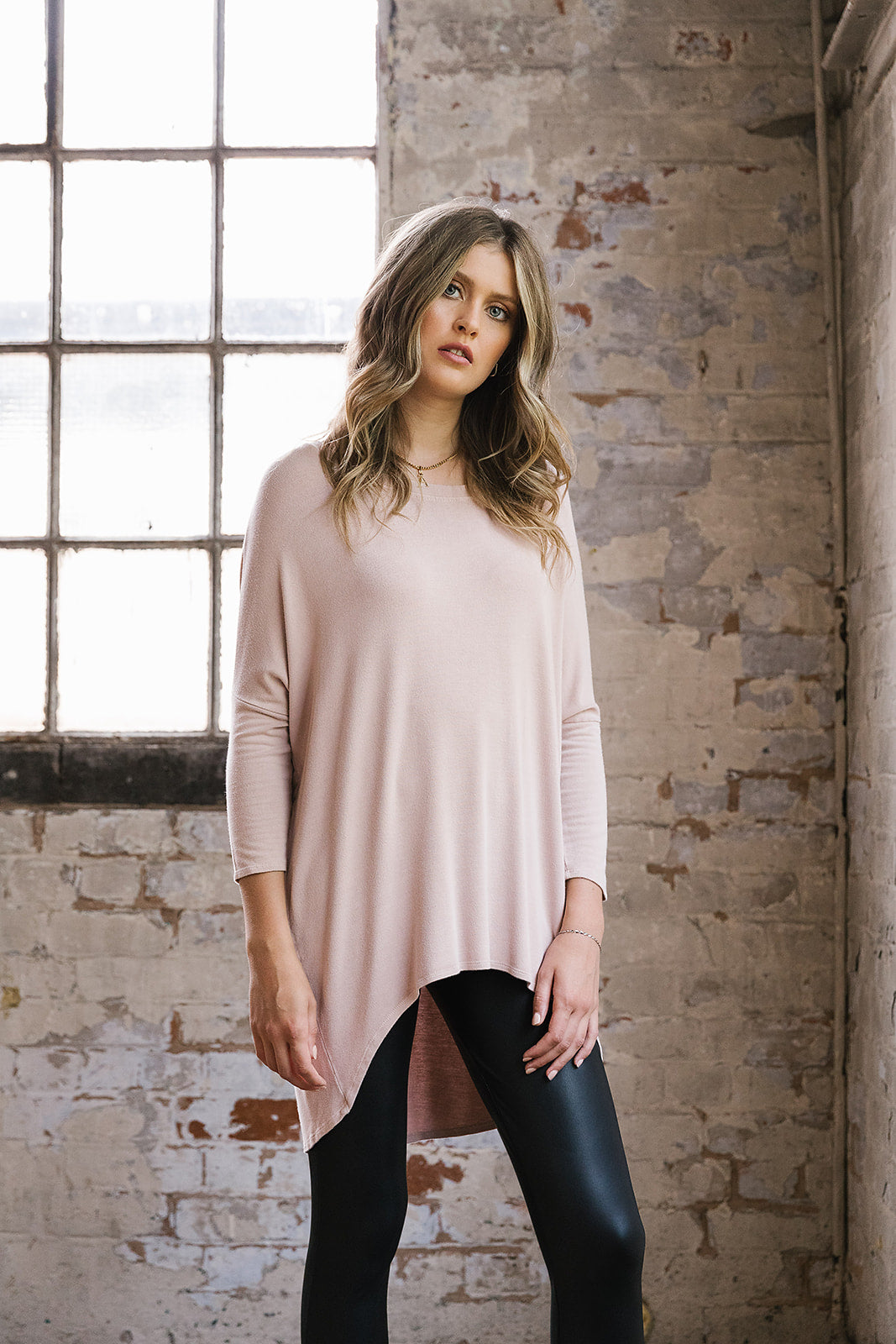 Flirty Long Line Dipped Back Knit
Top