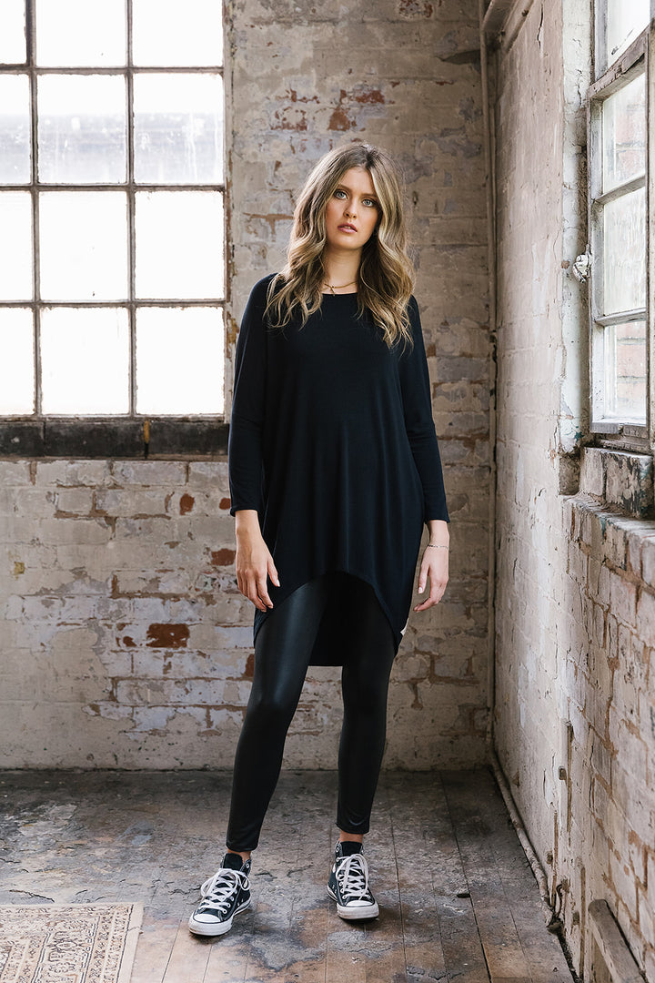 Flirty Long Line Dipped Back Knit
Top