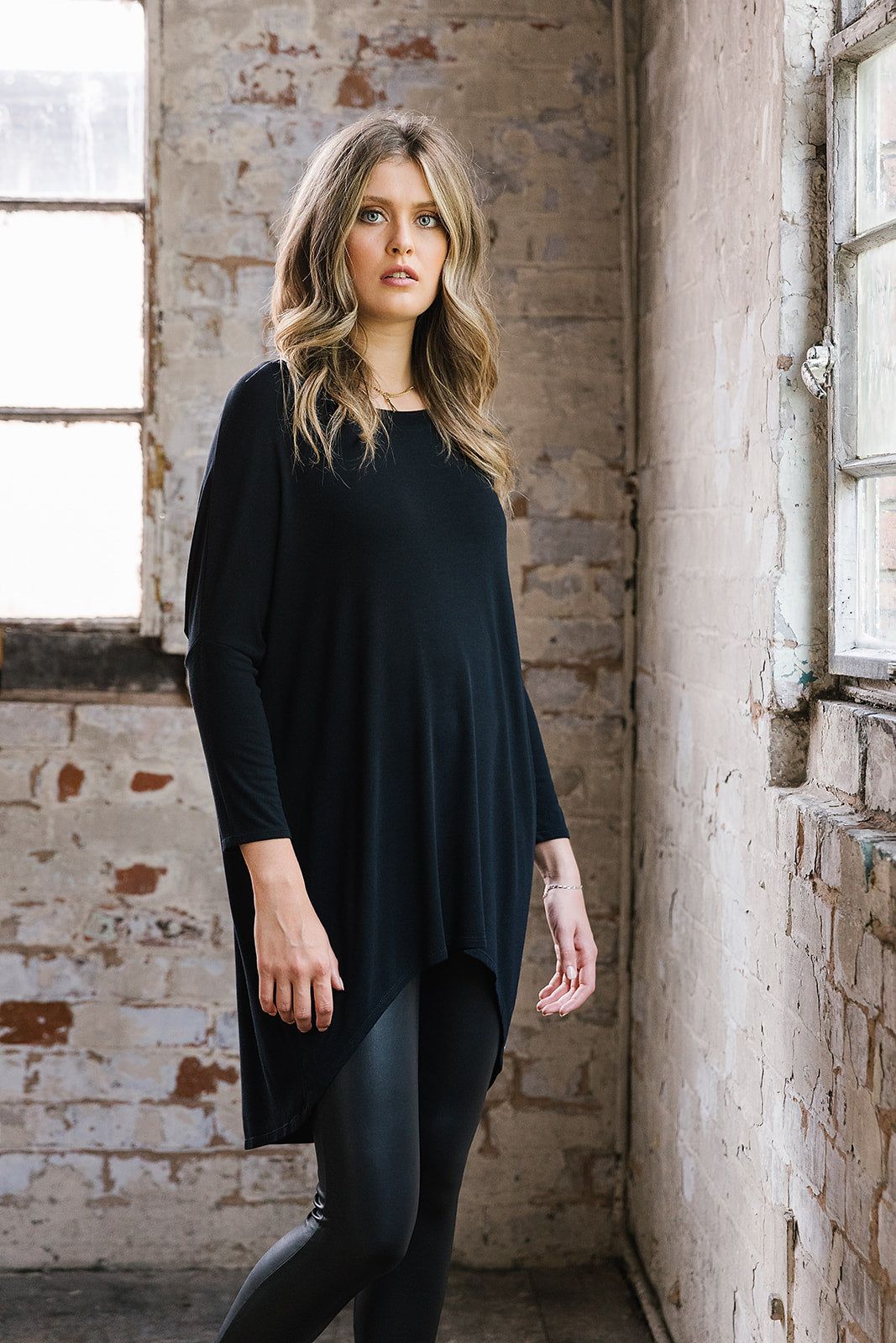 Flirty Long Line Dipped Back Knit
Top