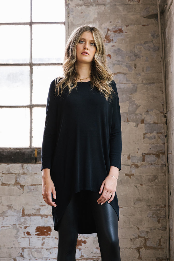 Flirty Long Line Dipped Back Knit
Top