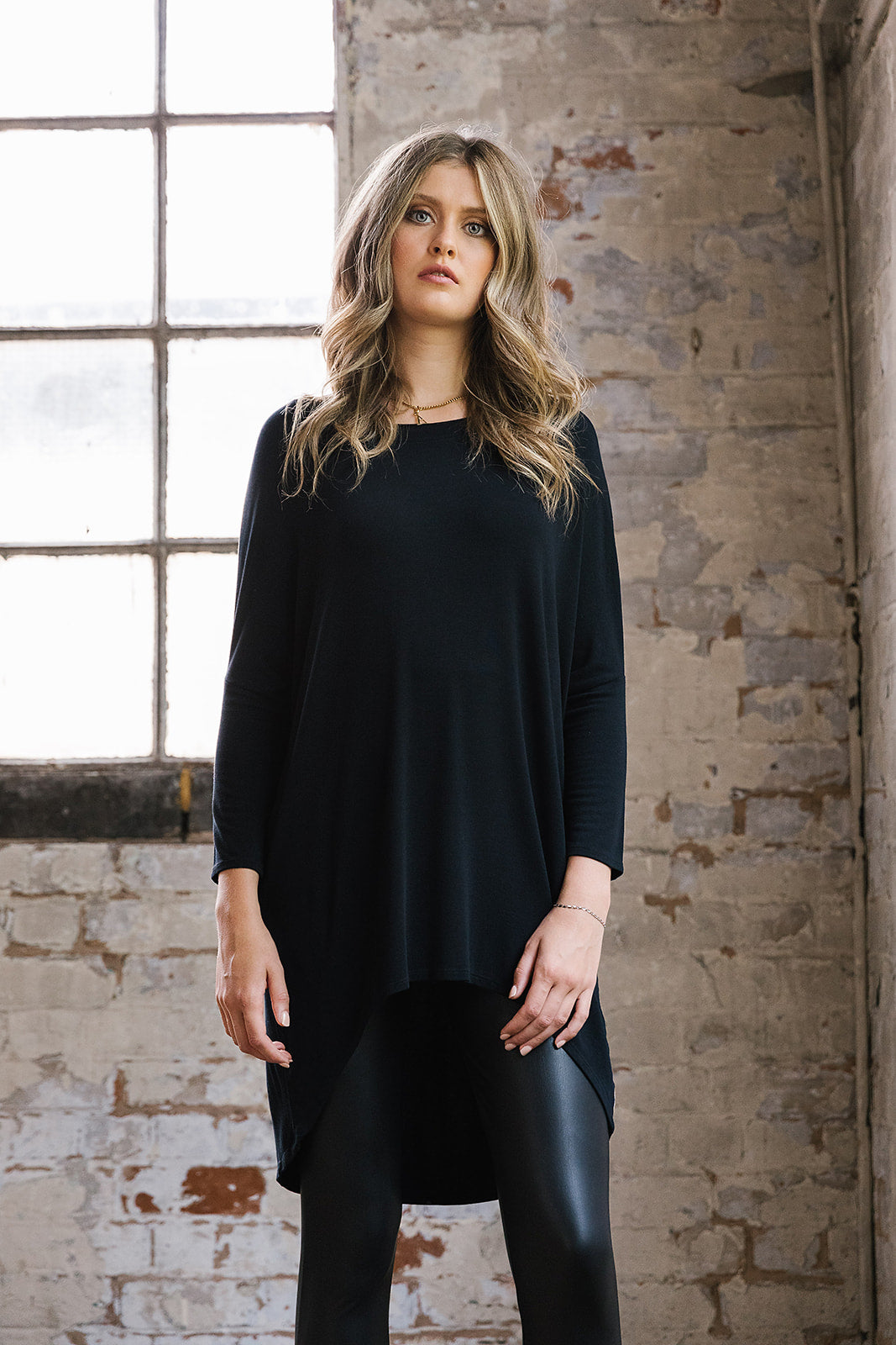 Flirty Long Line Dipped Back Jersey Knit Top