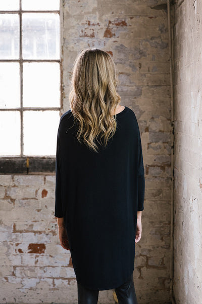 Flirty Long Line Dipped Back Jersey Knit Top