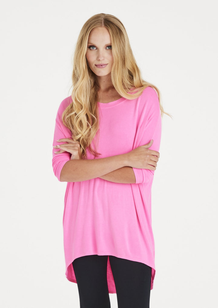 Flirty Long Line Dipped Back Knit Top